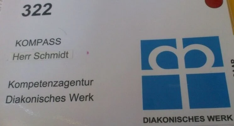 Türschild der Kompetenzagentur beim Diakonischen Werk